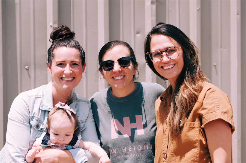 3 women smiling for the camera.