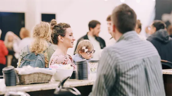 People talking at the coffee bar