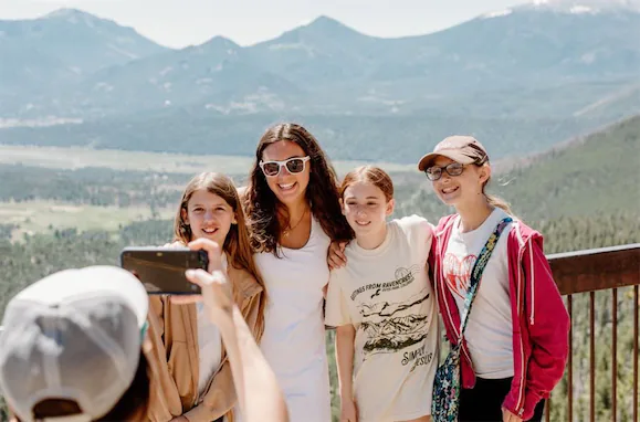 Girls Taking a photo at a scenic overlook