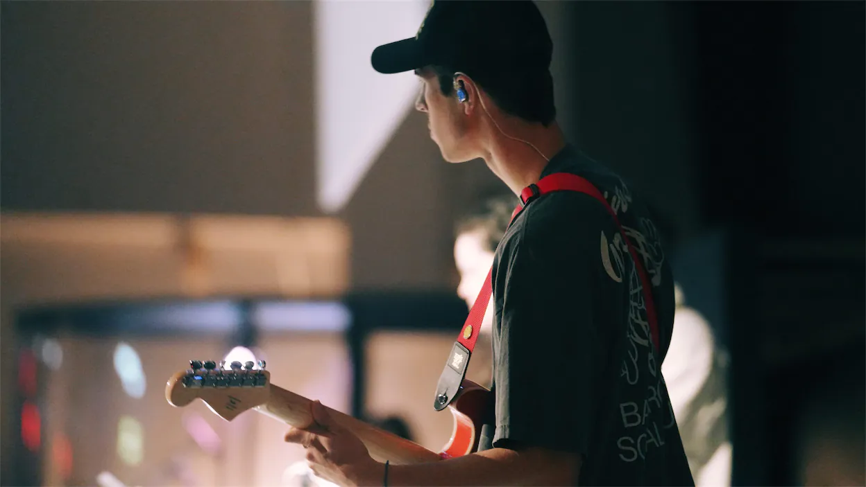 a man playing electric guitar