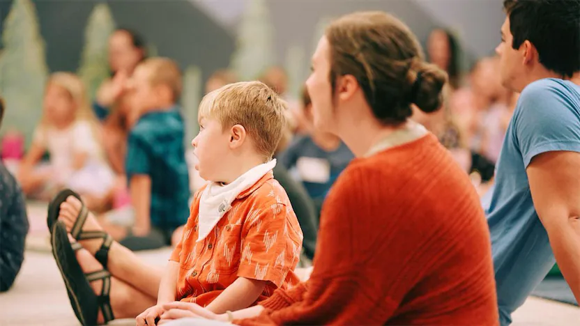 Teacher sitting with a child with special needs.