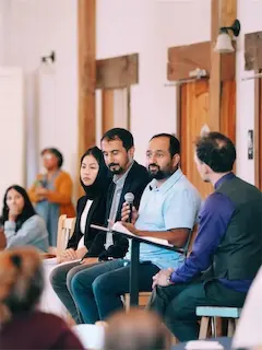 Diverse panel of experts talking at an event